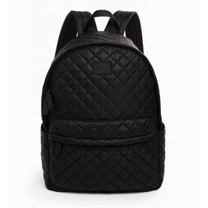 Black quilted backpack by Danskin